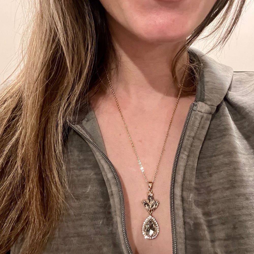 Worn once, gold colored necklace with rhinestones